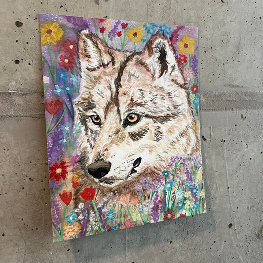 painting of a wolf surrounded by wildflowers