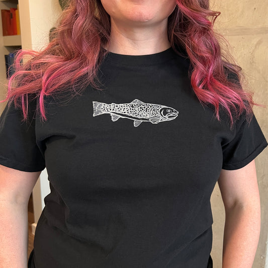 Person wearing a black t-shirt with a white fish design.