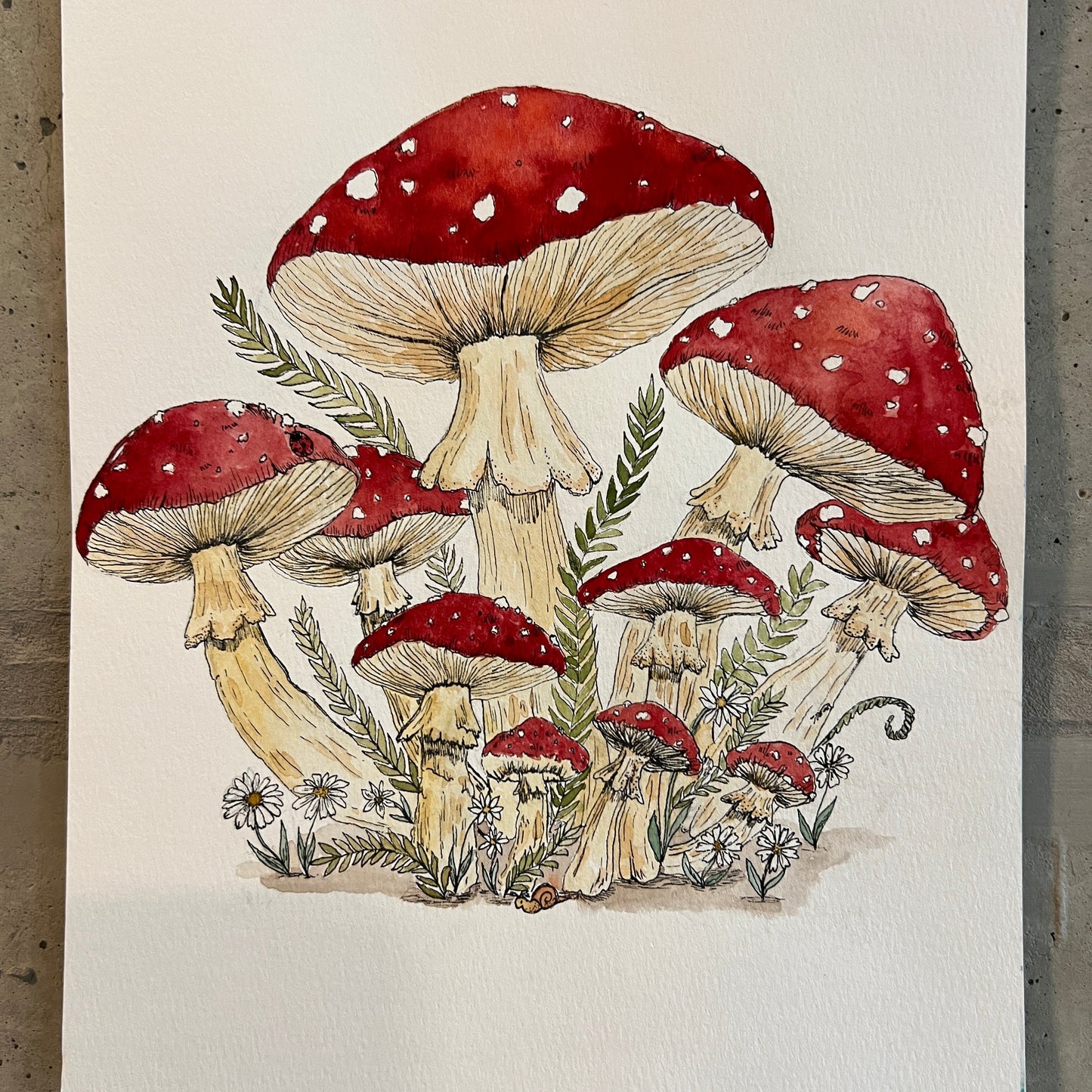 Illustration of red and white mushrooms on a textured surface