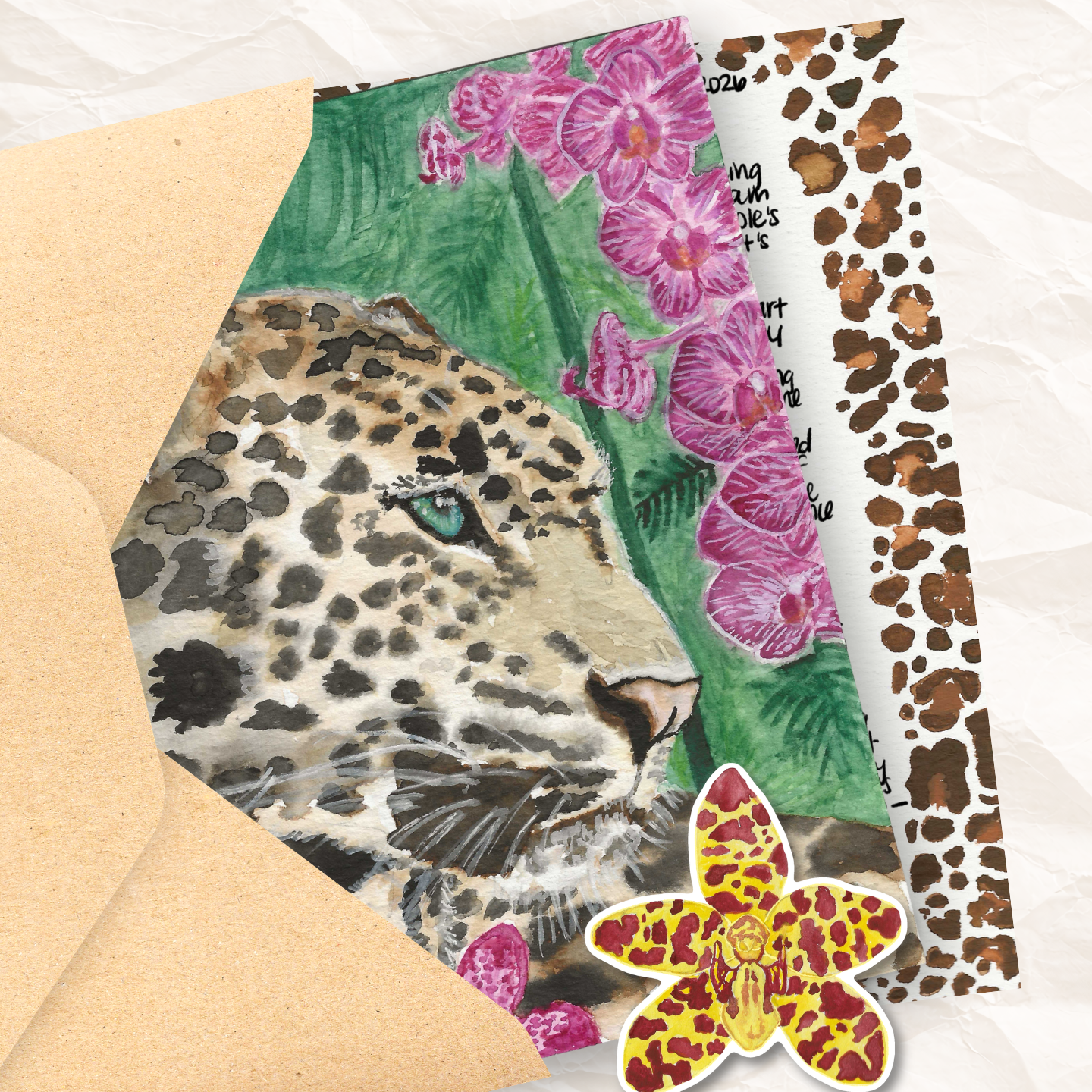 photo of an open envelope with an art print of a leopard, a letter and an orchid sticker coming out of it
